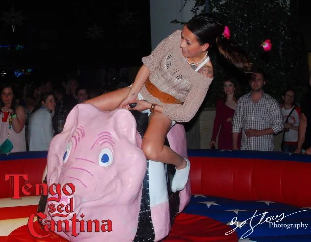 Rider on pink mechanical hog at Tengo Sed Cantina