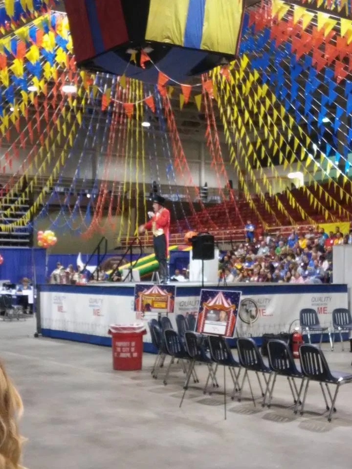 Circus-themed auditorium event with ringmaster