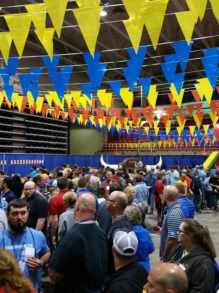Indoor corporate event with mechanical bull and pennants